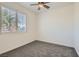 A secondary bedroom provides room to relax with its carpet and plantation shutters at 8040 Arcadian Ln, Las Vegas, NV 89147