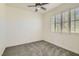 A secondary bedroom provides room to relax with its carpet and plantation shutters at 8040 Arcadian Ln, Las Vegas, NV 89147