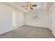 A spacious bedroom provides room to relax with its carpet, ceiling fan, and plantation shutters at 8040 Arcadian Ln, Las Vegas, NV 89147