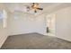 A spacious bedroom provides room to relax with its carpet, ceiling fan, and plantation shutters at 8040 Arcadian Ln, Las Vegas, NV 89147