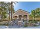 Elegant clubhouse with stone accents, manicured landscaping, and inviting entrance, perfect for gatherings at 8040 Arcadian Ln, Las Vegas, NV 89147