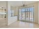 Bright dining area with modern lighting and large sliding glass door at 8040 Arcadian Ln, Las Vegas, NV 89147