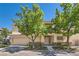 Charming two-story home with a two-car garage and mature trees at 8040 Arcadian Ln, Las Vegas, NV 89147