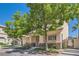 Two-story home with stone accents, landscaped front yard, and paver driveway at 8040 Arcadian Ln, Las Vegas, NV 89147