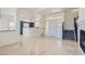 Spacious living room featuring tile floors and an open layout with a kitchen view at 8040 Arcadian Ln, Las Vegas, NV 89147