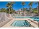 Inviting community pool and spa surrounded by mature trees, providing a relaxing oasis at 8040 Arcadian Ln, Las Vegas, NV 89147