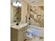 Bathroom boasts modern fixtures, marble-look tile, sleek vanity with stone countertop, and a shower-tub combo at 8397 San Ramon Dr, Las Vegas, NV 89147