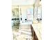 Bright bathroom features a modern dual sink vanity, tub, shower, and marble-look tile at 8397 San Ramon Dr, Las Vegas, NV 89147