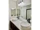 Elegant bathroom with dual vessel sinks, a large mirror, and a walk-in shower at 8397 San Ramon Dr, Las Vegas, NV 89147