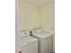 A laundry room features a stacked washer and dryer hookup at 8397 San Ramon Dr, Las Vegas, NV 89147