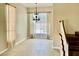 Spacious living room featuring a modern chandelier and tile flooring at 8397 San Ramon Dr, Las Vegas, NV 89147