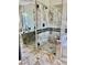 Modern shower featuring black hardware, glass enclosure, gray tile and a built-in niche at 8397 San Ramon Dr, Las Vegas, NV 89147