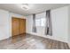 Bedroom featuring new hardwood floors and a bright window with modern curtains at 875 Rhinegold Way, Las Vegas, NV 89110