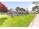An open green space with manicured lawn surrounds community pool and buildings at 875 Rhinegold Way, Las Vegas, NV 89110