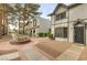 View of well maintained townhomes and landscape, showcasing a bright neighborhood at 875 Rhinegold Way, Las Vegas, NV 89110