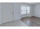 Living room features durable wood-look flooring and a bright bay window at 875 Rhinegold Way, Las Vegas, NV 89110