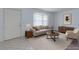 Bright living room with large bay window, neutral furniture, and stylish decor at 875 Rhinegold Way, Las Vegas, NV 89110