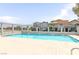 Community pool area featuring a large swimming pool and wrought iron fence at 875 Rhinegold Way, Las Vegas, NV 89110