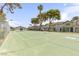 Well maintained tennis court surrounded by lush landscaping and mature trees at 875 Rhinegold Way, Las Vegas, NV 89110