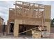 New home construction showing wooden framing, plywood sheathing, and open garage space at 9243 Charmillin Ct, Las Vegas, NV 89148