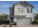 Charming two-story home featuring a two-car garage and inviting front entrance at 9249 Charmillin Ct, Las Vegas, NV 89148