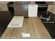Display of kitchen and bathroom finish samples featuring cabinets, paint, quartz, vinyl plank and faucet at 9249 Charmillin Ct, Las Vegas, NV 89148
