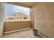 Private balcony featuring stucco walls, a small pot, and a view of the surrounding community at 9303 Gilcrease Ave # 1002, Las Vegas, NV 89149