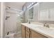 Modern bathroom with a glass-enclosed shower and double sink vanity at 9303 Gilcrease Ave # 1002, Las Vegas, NV 89149