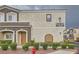 Stunning two-story condo featuring a cozy front porch, desert landscaping, and easy access to community amenities at 9303 Gilcrease Ave # 1002, Las Vegas, NV 89149