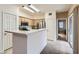 Well-lit kitchen features a breakfast bar, stainless steel appliances, and access to the patio at 9303 Gilcrease Ave # 1002, Las Vegas, NV 89149