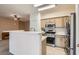 Modern kitchen featuring a breakfast bar and stainless steel appliances at 9303 Gilcrease Ave # 1002, Las Vegas, NV 89149