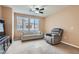 Cozy living room featuring comfortable seating, a ceiling fan, and a bright window for a relaxing atmosphere at 9303 Gilcrease Ave # 1002, Las Vegas, NV 89149
