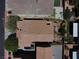 A bird's eye view shows the roof and well-maintained backyard with a pergola, lush plantings, and a patio area at 9370 Corkfish St, Las Vegas, NV 89178