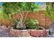 A serene backyard water feature is surrounded by lush greenery, enhancing the peaceful ambiance of the outdoor space at 9370 Corkfish St, Las Vegas, NV 89178