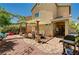 Outdoor living with a covered patio, dining area, desert landscaping, and built-in grill offer great entertainment space at 9370 Corkfish St, Las Vegas, NV 89178