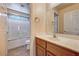 Bright bathroom with modern sink vanity, and shower-tub combo at 9370 Corkfish St, Las Vegas, NV 89178