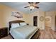Bedroom boasts wood laminate floors, and a walk-in closet providing ample storage space for clothing and personal items at 9370 Corkfish St, Las Vegas, NV 89178