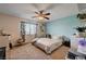 Bedroom featuring large window and ceiling fan at 9370 Corkfish St, Las Vegas, NV 89178