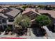 Attractive two-story home with mature landscaping, a well-manicured lawn and a driveway leading to an attached garage at 9370 Corkfish St, Las Vegas, NV 89178