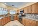 Spacious kitchen featuring stainless steel appliances and plenty of cabinet space at 9370 Corkfish St, Las Vegas, NV 89178