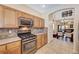 This well-lit kitchen is equipped with stainless steel appliances and modern cabinetry at 9370 Corkfish St, Las Vegas, NV 89178