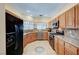 Well-equipped kitchen with stainless steel appliances, ample cabinet space and a kitchen sink at 9370 Corkfish St, Las Vegas, NV 89178