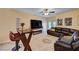 Comfortable living room featuring a sectional sofa, bar table and a cozy fireplace at 9370 Corkfish St, Las Vegas, NV 89178