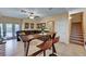 Open-concept living area boasts a comfortable seating area, unique bar-height table, and easy access to outdoor space at 9370 Corkfish St, Las Vegas, NV 89178