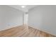 Bedroom with a ceiling fan, wood floor, and a connecting door to another room at 9917 Arbuckle Dr, Las Vegas, NV 89134