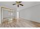Bedroom with a ceiling fan, wood floor, closet, and natural light at 9917 Arbuckle Dr, Las Vegas, NV 89134