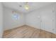 Bright bedroom featuring a ceiling fan, wood floor, and natural light at 9917 Arbuckle Dr, Las Vegas, NV 89134