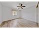 Simple bedroom with a ceiling fan, wood floor, and natural light at 9917 Arbuckle Dr, Las Vegas, NV 89134