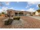 Charming single-story home with desert landscaping and a well-manicured lawn at 9917 Arbuckle Dr, Las Vegas, NV 89134