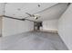 Spacious garage with ample storage cabinets along the walls and concrete floor at 9917 Arbuckle Dr, Las Vegas, NV 89134